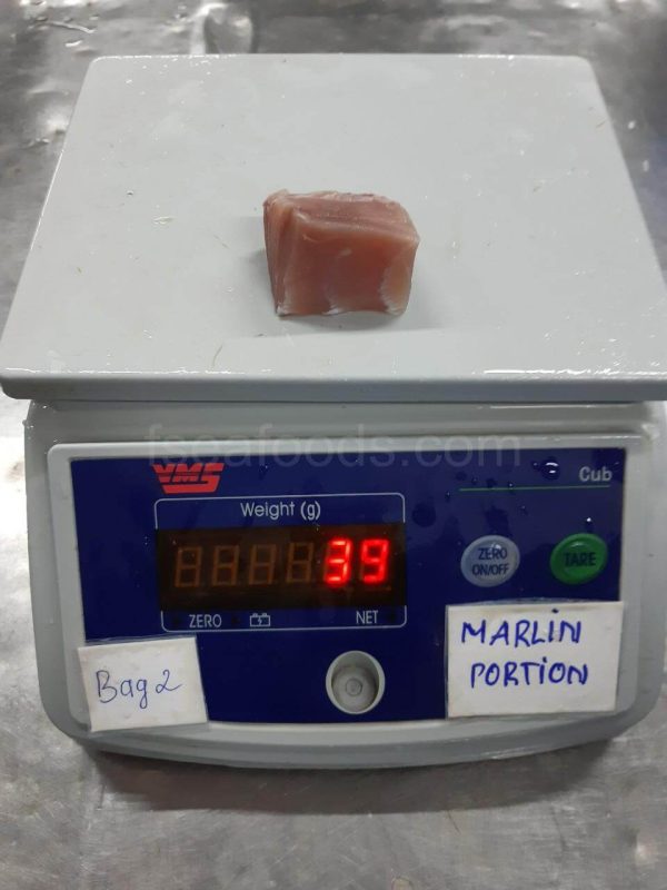 Close-up of high-quality frozen marlin fish cubes, individually quick frozen (IQF), packaged for export by F Seafood Vietnam.